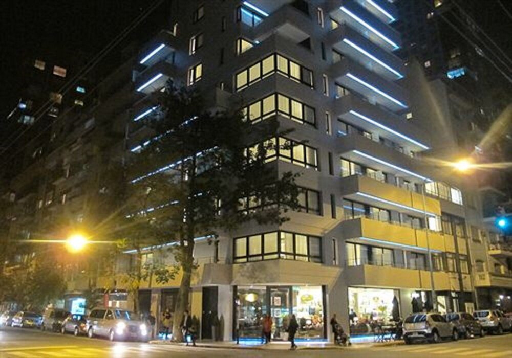 Multi-story Bulnes Eco Suites building with a modern design