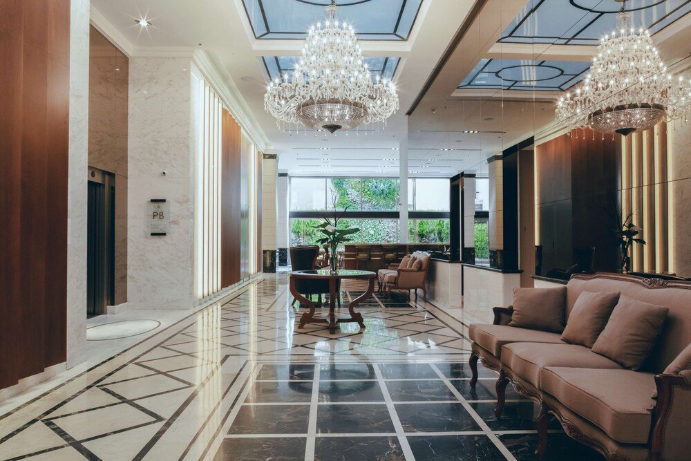 Spacious hotel lobby with a marble floor