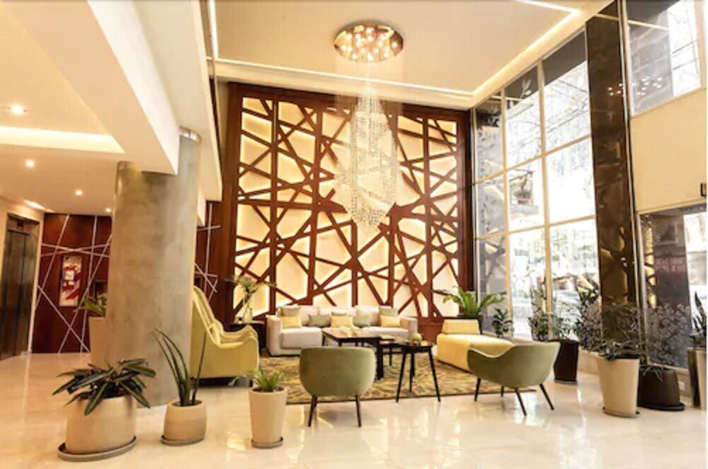 Modern lobby with a geometric wall design at Konke Buenos Aires Hotel