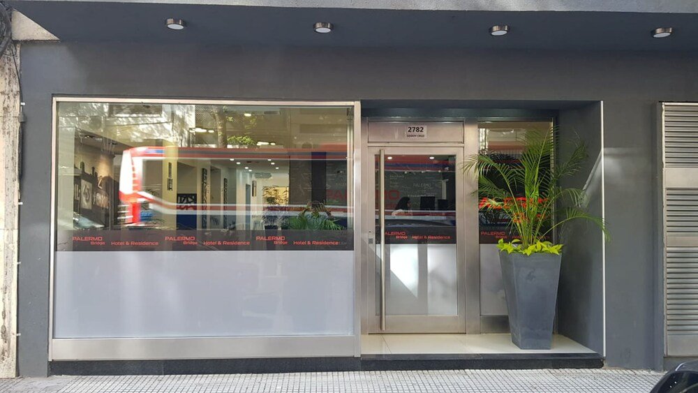 Hotel entrance with a large glass door in Palermo, Buenos Aires